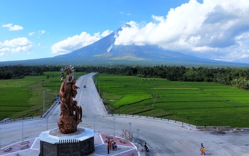 Mayon Volcano with Giant Statue of Nuestra Señora de Salvación
